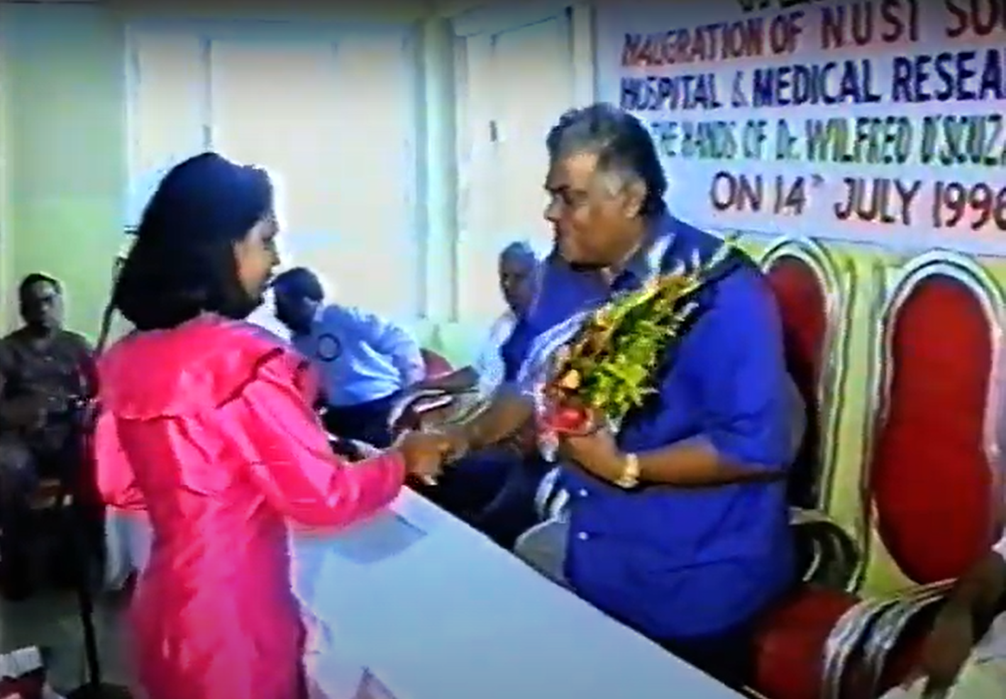 Goan sailors daughter giving a bouque of flowers to LB 